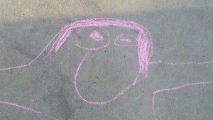 My portrait in sidewalk chalk, drawn by my son (circa March 2010).