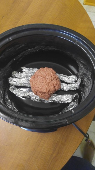 Here is what a hamburger patty looks like on top of the foil.