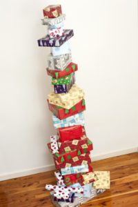 Stacked tower of colourful Christmas gifts